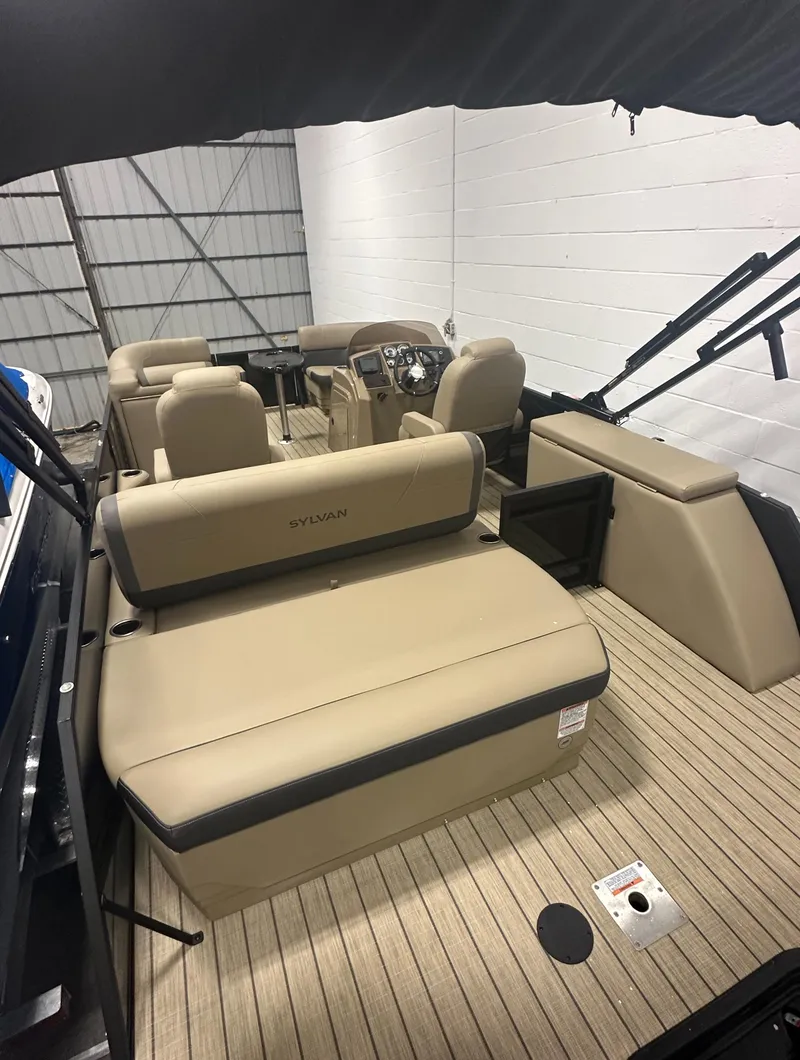 Slide: The Image of 2025 Sylvan MIRAGE X1 CLZ DH boat interior with beige seating and modern dashboard. - 5