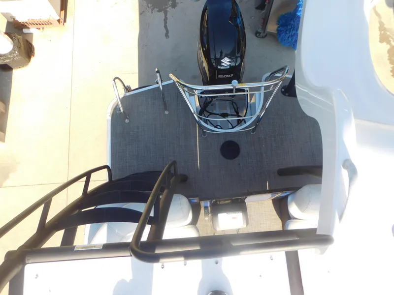 Slide: The Image of 2016 Legend Boats V20 VC with Suzuki outboard motor, top view of deck and seating area. - 11