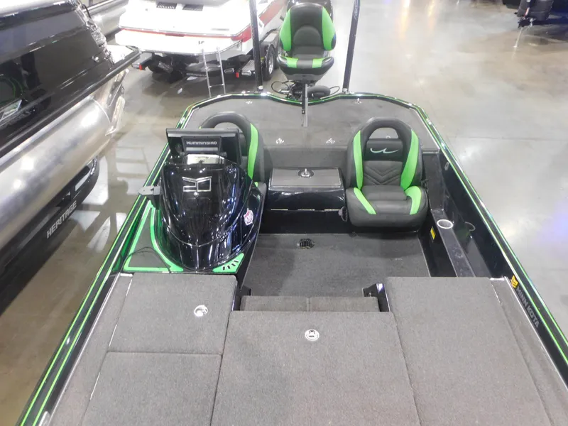 Slide: The Image of 2016 Legend Boats V20 VC with green and black interior, displayed indoors. - 4