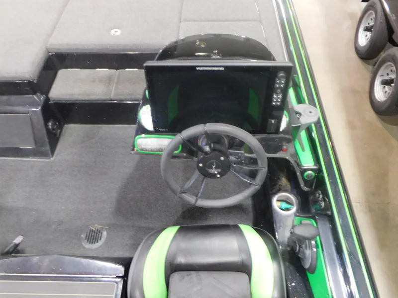 Slide: The Image of 2016 Legend Boats V20 VC cockpit with steering wheel and control panel. - 6