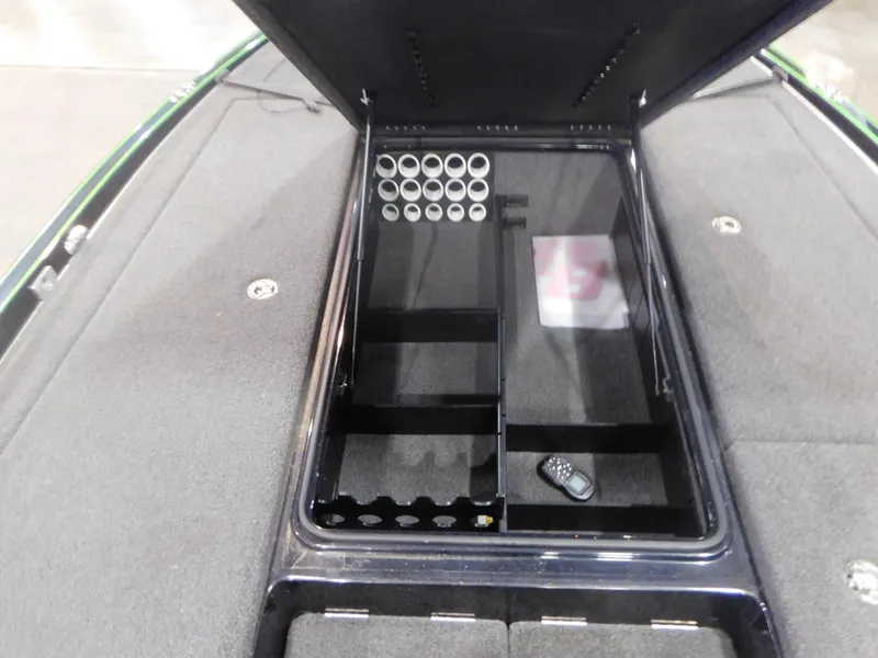 Slide: The Image of 2016 Legend Boats V20 VC storage compartment with rod holders and remote. - 7
