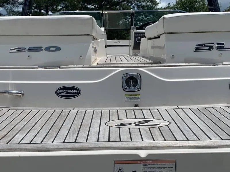 Slide: The Image of 2014 Sea Ray SLX 250 boat deck with MarineMax logo and seating. - 3