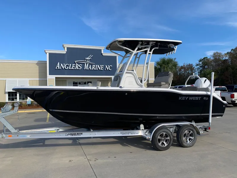 The Image of 2024 Key West 219 FS boat on trailer at Anglers Marine NC dealership. - 0