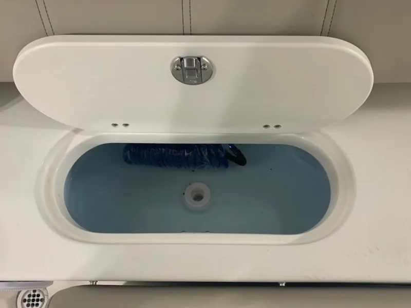 Slide: The Image of 2024 Key West 219 FS boat livewell with water and hose. - 5