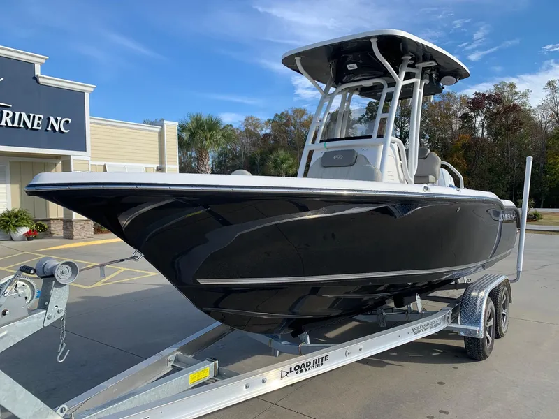 Slide: The Image of 2024 Key West 219 FS boat on trailer outside dealership. - 3