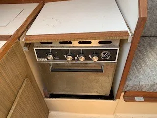 Slide: The Image of 1970 Pearson 35 Sloop galley with vintage stove and oven. - 11