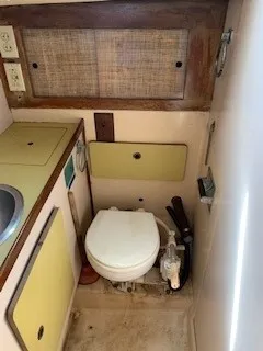 Slide: The Image of 1970 Pearson 35 Sloop bathroom with toilet and sink. - 16