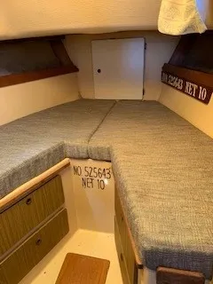 Slide: The Image of Interior cabin of a 1970 Pearson 35 Sloop sailboat with cushioned V-berth. - 19