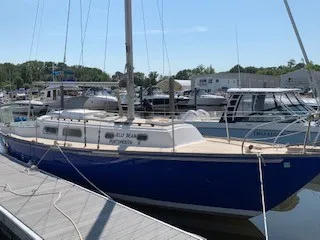 Slide: The Image of 1970 Pearson 35 Sloop docked at a marina. - 2