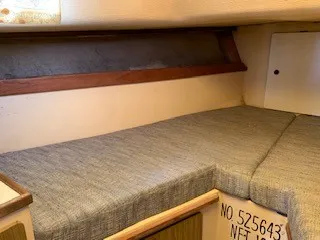 Slide: The Image of Interior cabin of a 1970 Pearson 35 Sloop sailboat with cushioned seating. - 21