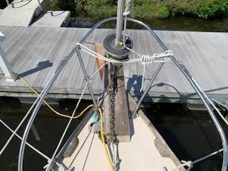 Slide: The Image of Bow of a 1970 Pearson 35 Sloop docked at a marina. - 6