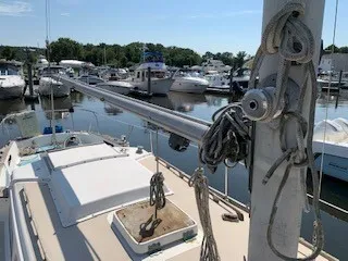 Slide: The Image of 1970 Pearson 35 Sloop sailboat docked in a marina with other boats. - 8