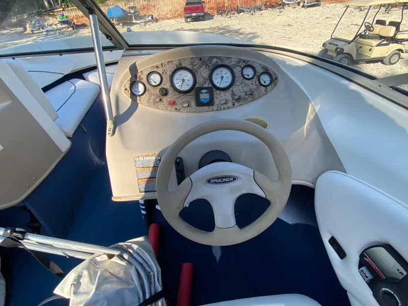 Slide: The Image of 2001 Bayliner 215 Bowrider dashboard and steering wheel. - 10