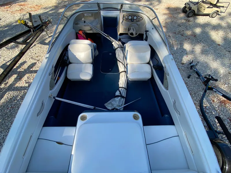 Slide: The Image of 2001 Bayliner 215 Bowrider boat interior with seating and steering wheel. - 17