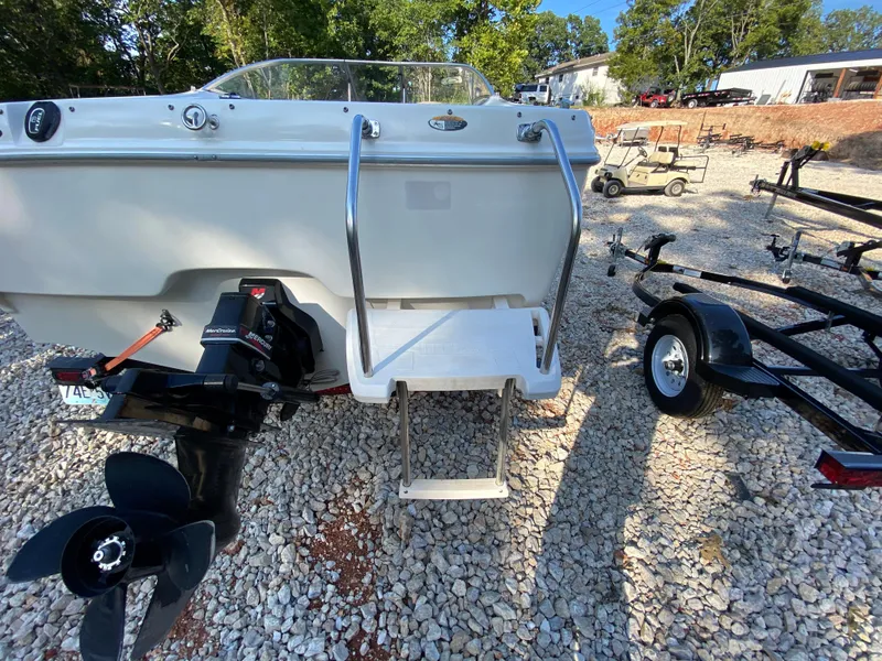 Slide: The Image of 2001 Bayliner 215 Bowrider boat stern with ladder and outboard motor. - 18