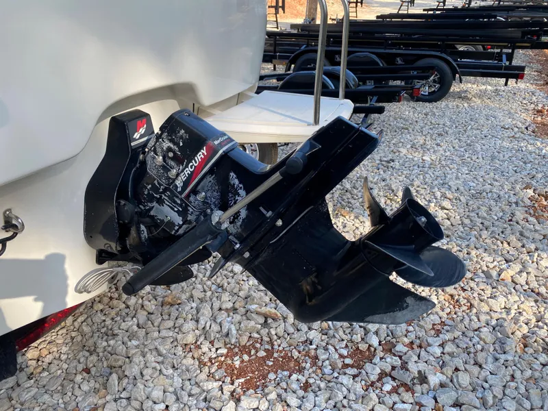 Slide: The Image of 2001 Bayliner 215 Bowrider with Mercury outboard motor on gravel. - 20