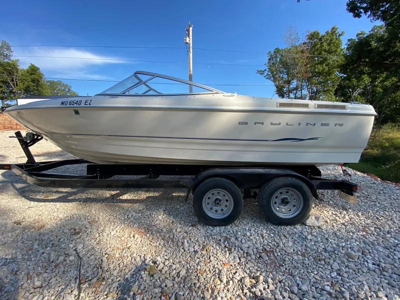 Slide: The Image of 2001 Bayliner 215 Bowrider on a trailer, side view. - 21