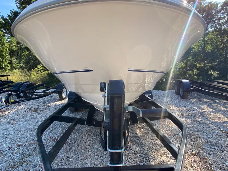 Slide: The Image of 2001 Bayliner 215 Bowrider boat on a trailer, front view. - 26
