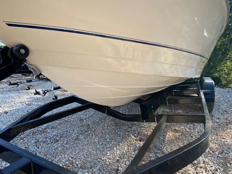 Slide: The Image of 2001 Bayliner 215 Bowrider boat on a trailer, close-up of the hull. - 29