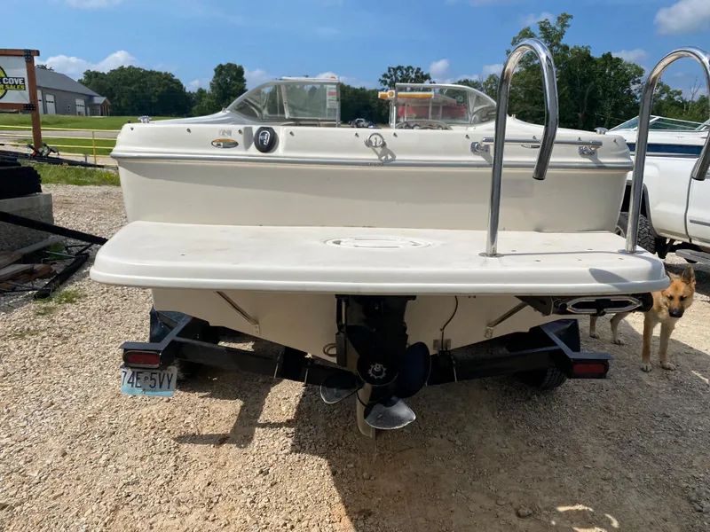 Slide: The Image of 2001 Bayliner 215 Bowrider boat, rear view, on a trailer. - 31