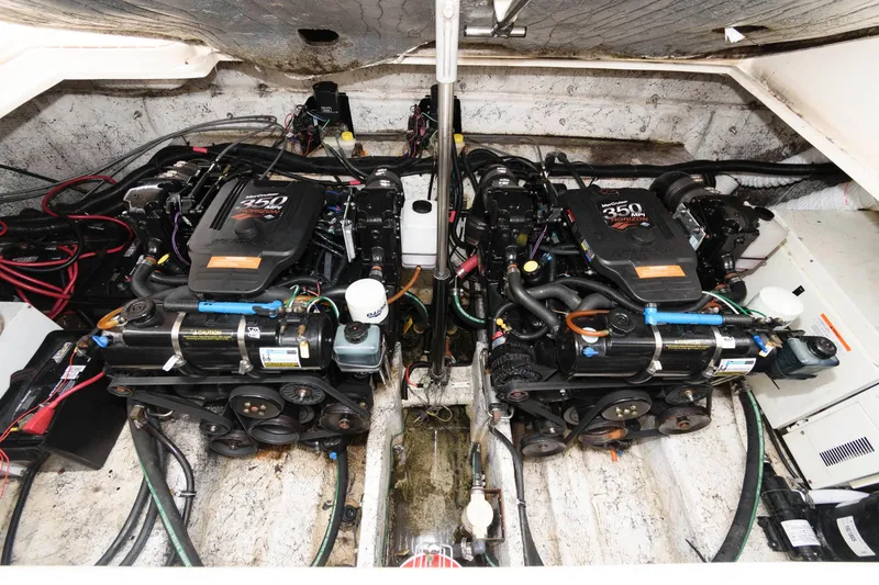 Slide: The Image of 2005 Rinker Fiesta Vee 342 engine compartment with twin 350 MAG MPI engines. - 13