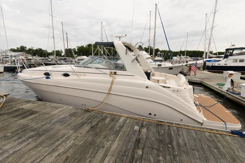 Slide: The Image of 2005 Rinker Fiesta Vee 342 docked at a marina. - 3