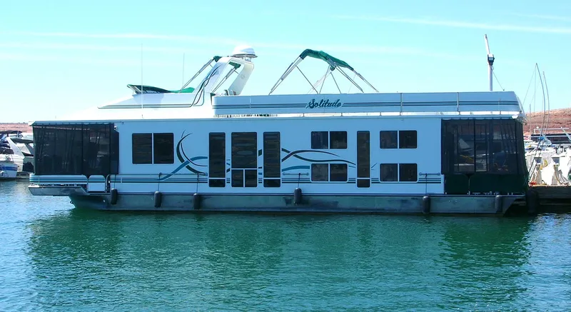 Slide: The Image of Houseboat "Horizon One Week a Month" 2000 model on calm water, featuring modern design. - 3