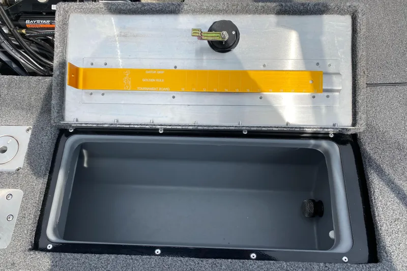 Slide: The Image of 2020 Tracker Pro Guide V175 boat storage compartment with measuring ruler. - 11