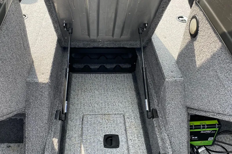 Slide: The Image of 2020 Tracker Pro Guide V175 boat storage compartment with open lid. - 13