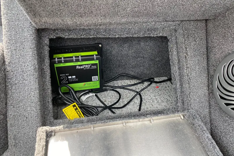 Slide: The Image of Battery compartment of a 2020 Tracker Pro Guide V175 boat with RealPRO battery charger. - 16