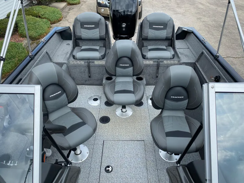 Slide: The Image of 2020 Tracker Pro Guide V175 boat interior with five gray seats. - 4
