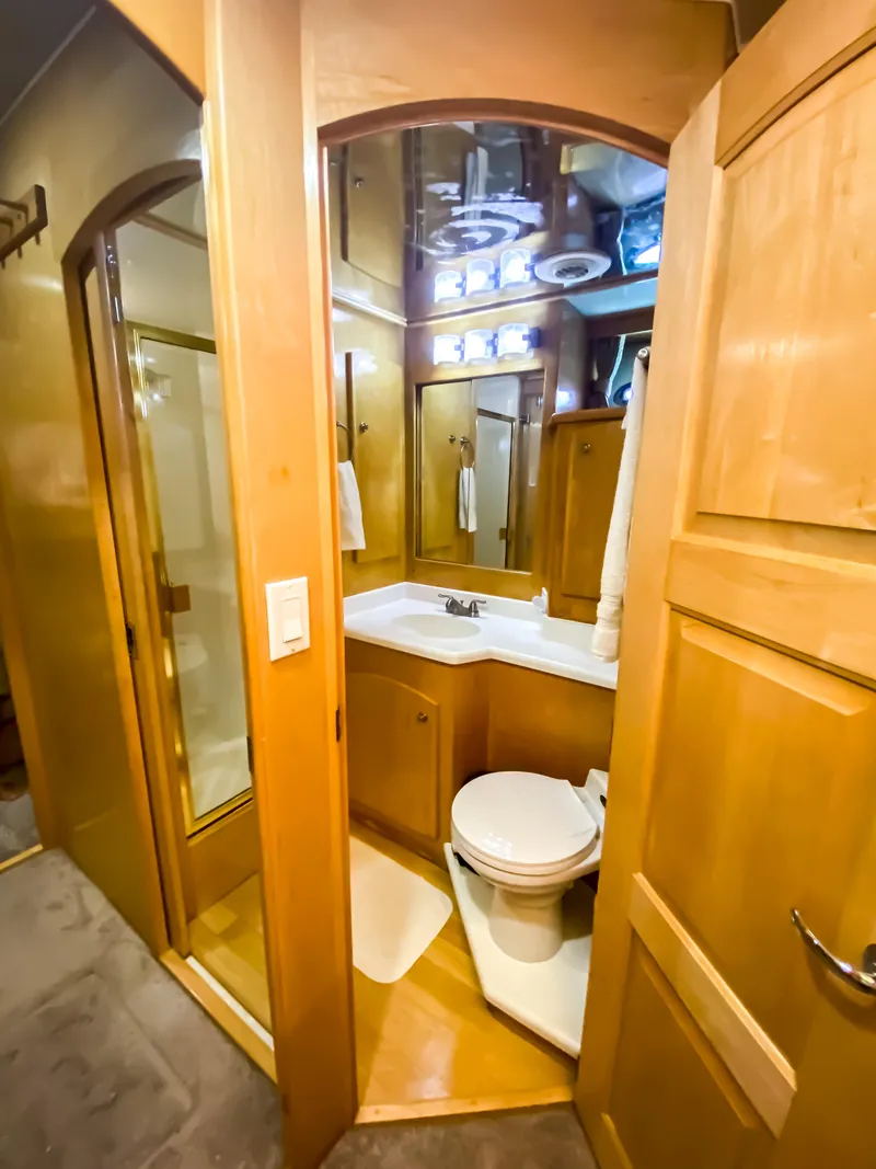 Slide: The Image of Compact bathroom in 1999 Navigator 5800 with wood cabinetry and modern fixtures. - 20