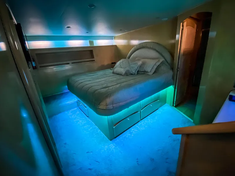 Slide: The Image of Luxurious bedroom in 1999 Navigator 5800 yacht with ambient blue lighting. - 26