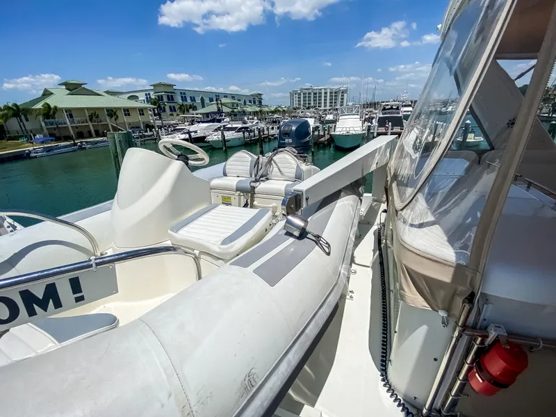 Slide: The Image of 1999 Navigator 5800 yacht docked at marina under clear blue sky. - 34