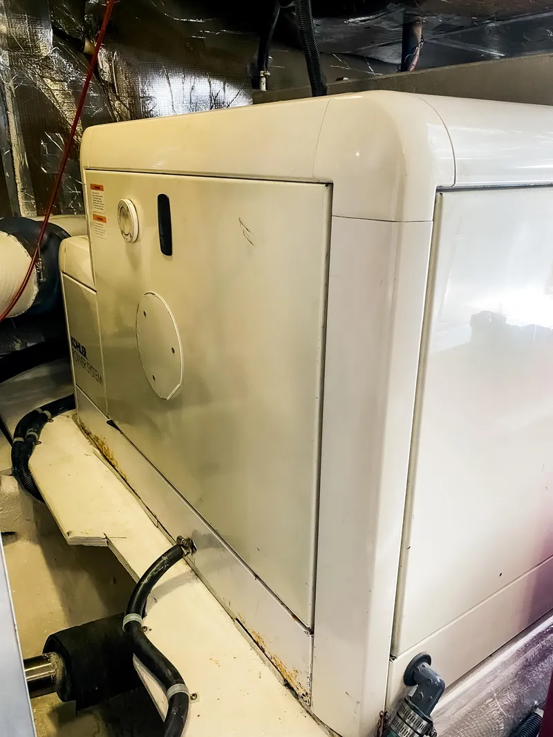 Slide: The Image of Navigator 5800 generator, 1999 model, in a boat engine room. - 38