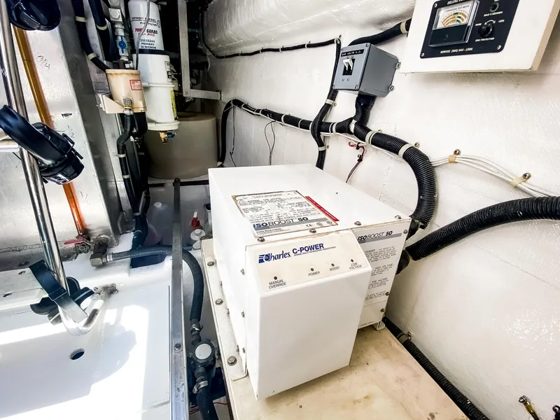 Slide: The Image of Engine room of 1999 Navigator 5800 yacht with electrical equipment and wiring. - 41