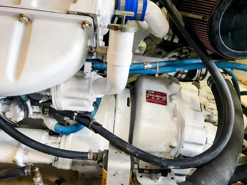 Slide: The Image of Close-up of a 1999 Navigator 5800 engine with visible hoses and components. - 42