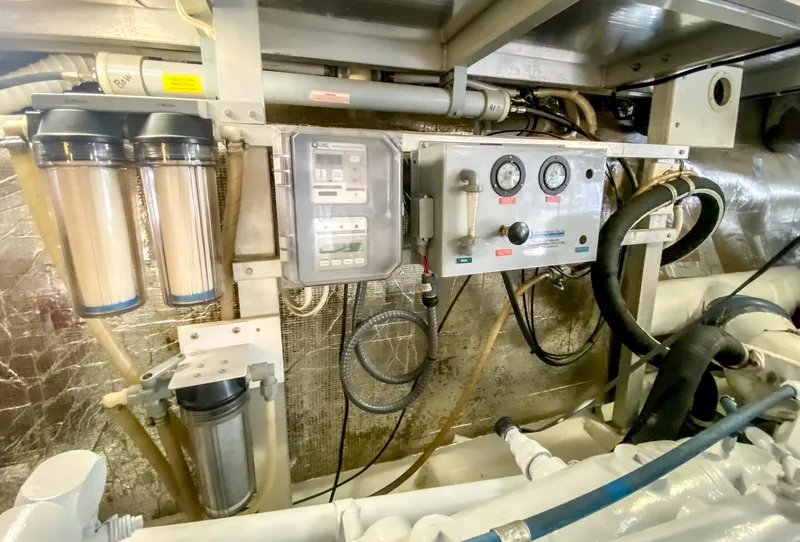 Slide: The Image of Engine room of 1999 Navigator 5800 yacht with control panel and filtration system. - 47