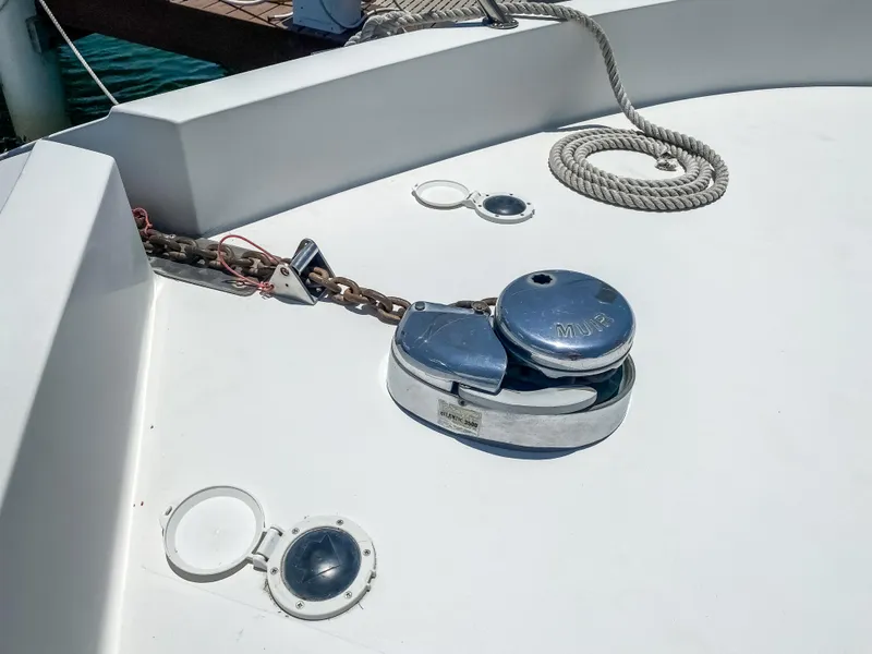 Slide: The Image of Anchor winch on 1999 Navigator 5800 yacht deck with rope and chain. - 6