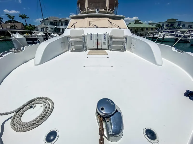 Slide: The Image of 1999 Navigator 5800 yacht deck with mooring rope and winch in marina. - 7