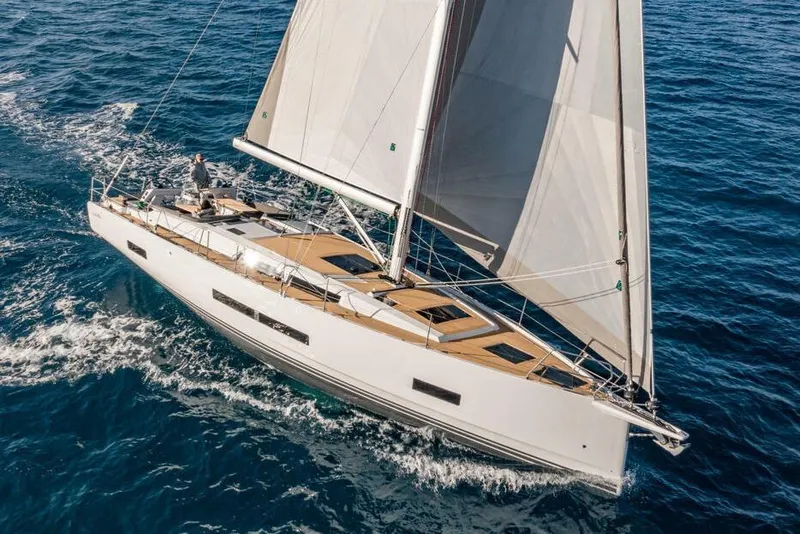 The Image of 2025 Hanse 460 yacht sailing on open sea with full sails. - 0
