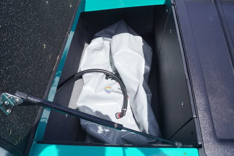 Slide: The Image of 2022 Axis A22 boat storage compartment with ballast bag and hose. - 33