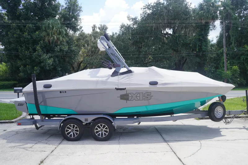 Slide: The Image of 2022 Axis A22 boat on trailer, covered, parked outdoors. - 38