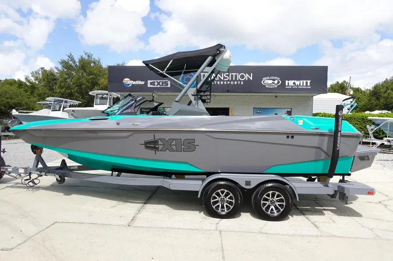 The Image of 2022 Axis A22 boat on a trailer at a dealership. - 0