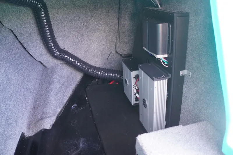 Slide: The Image of Interior view of 2022 Axis A22 boat showing electronic components and wiring. - 23