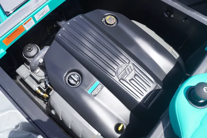 Slide: The Image of 2022 Axis A22 engine compartment with black cover and visible components. - 35