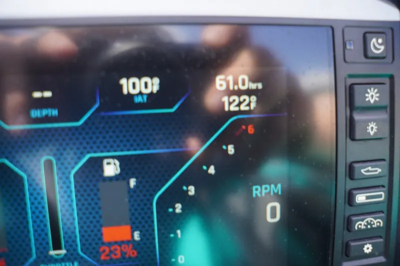 Slide: The Image of Dashboard display of a 2022 Axis A22 boat showing temperature, fuel, and RPM indicators. - 36