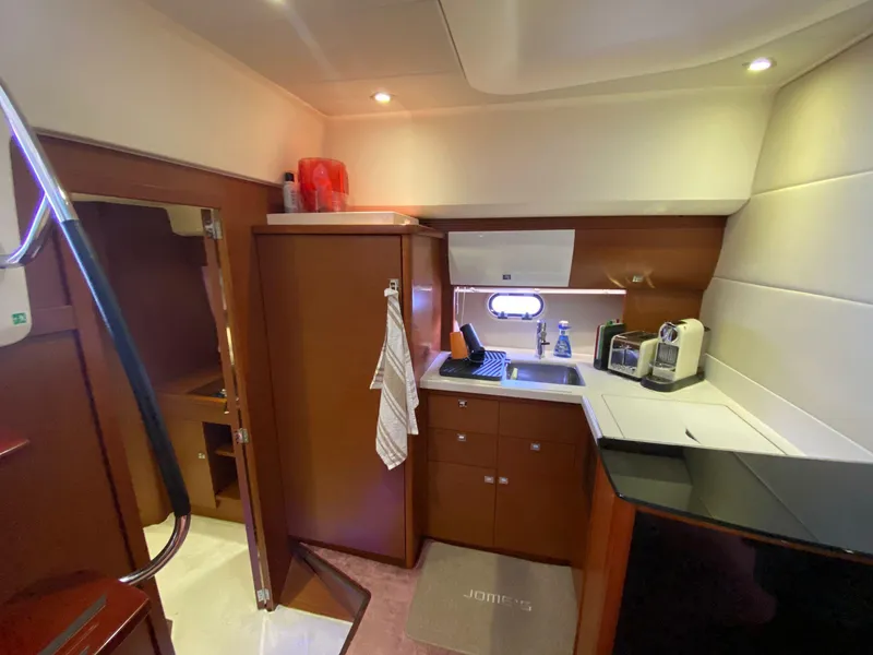 Slide: The Image of Interior of 2013 Prestige 440 S yacht kitchen with modern amenities. - 11