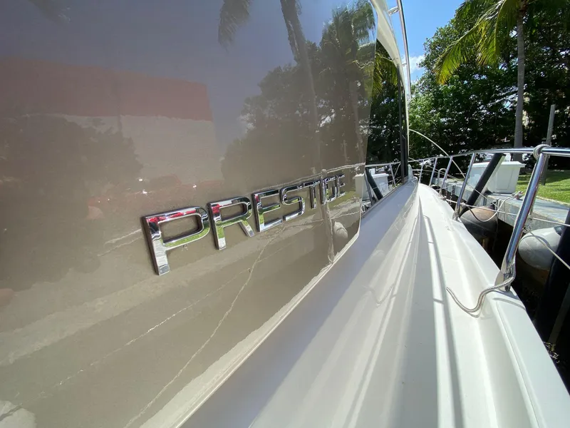 Slide: The Image of 2013 Prestige 440 S yacht side view with logo and railing. - 13