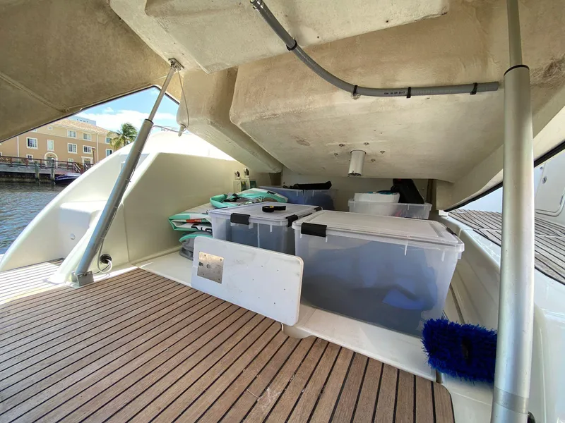 Slide: The Image of Storage area on 2013 Prestige 440 S yacht with organized containers. - 14